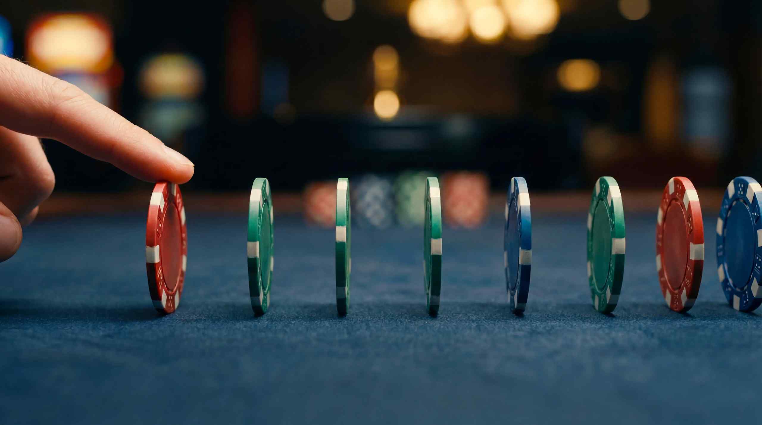 Casino chips standing upright on a gambling table.